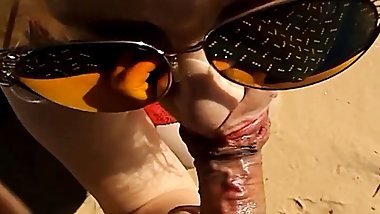 Blowjob from a mature mom on the beach