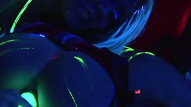 Horny lesbians fuck each other with a neon dildo in black light, crazy