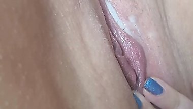 Hot milf is rubbing her pussy until she comes with white juice