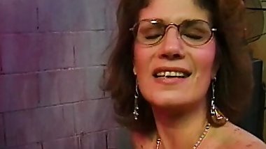 Older bitch with glasses gets banged hard in 3some on couch