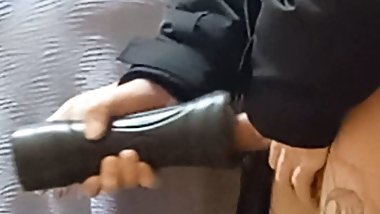 jerking off with a sex toy to a courier, close-up