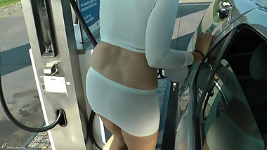 Refuel at the gas station in a mini skirt and no bra