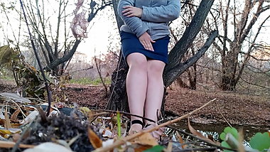 Peeing outdoors legs spread wide