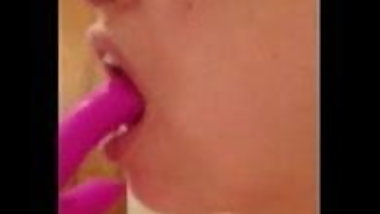 Sucking on her toy