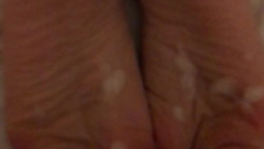 Younger man's cumshot on mature wife's wrinkled soles